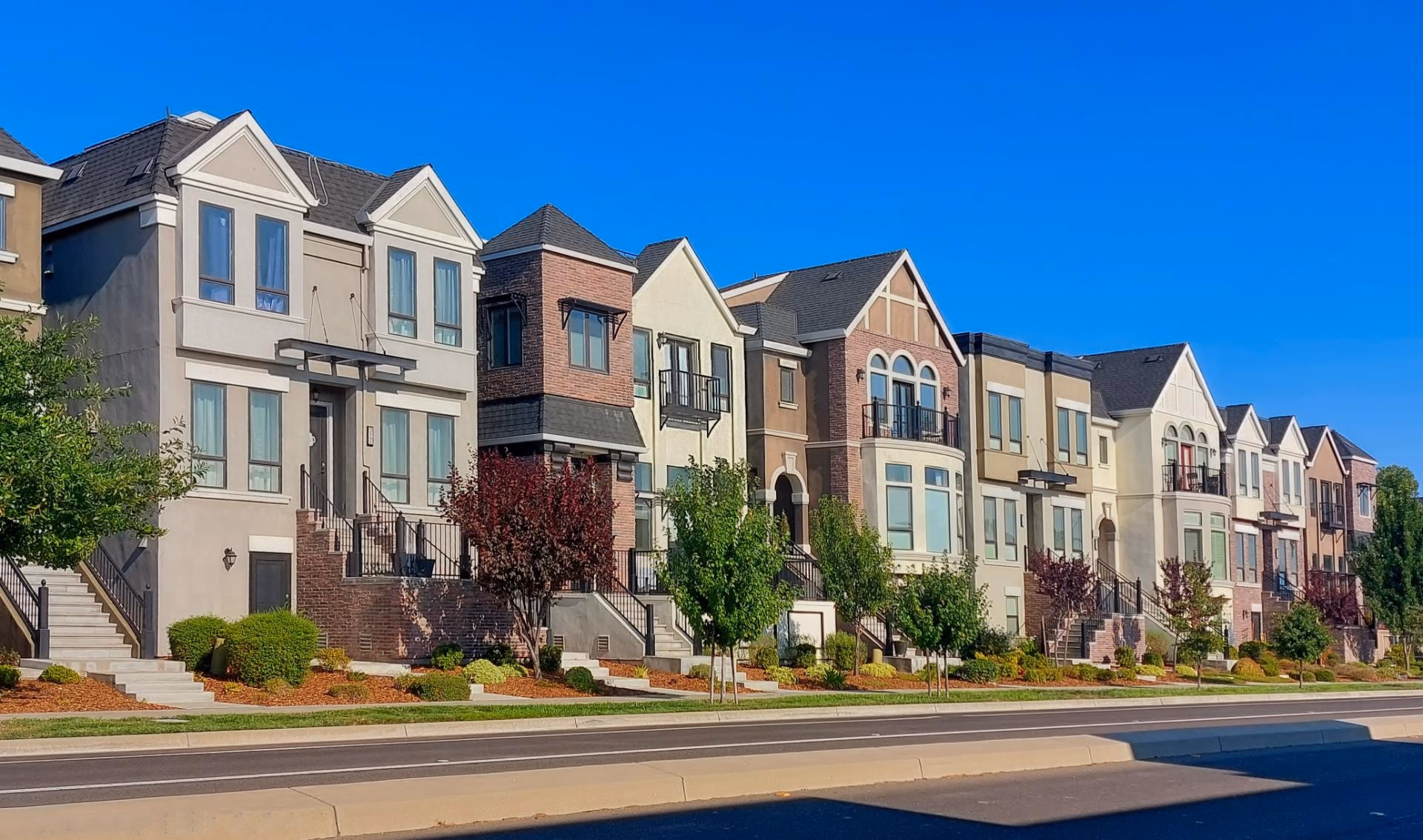 Row of townhomes with landscaped front yards