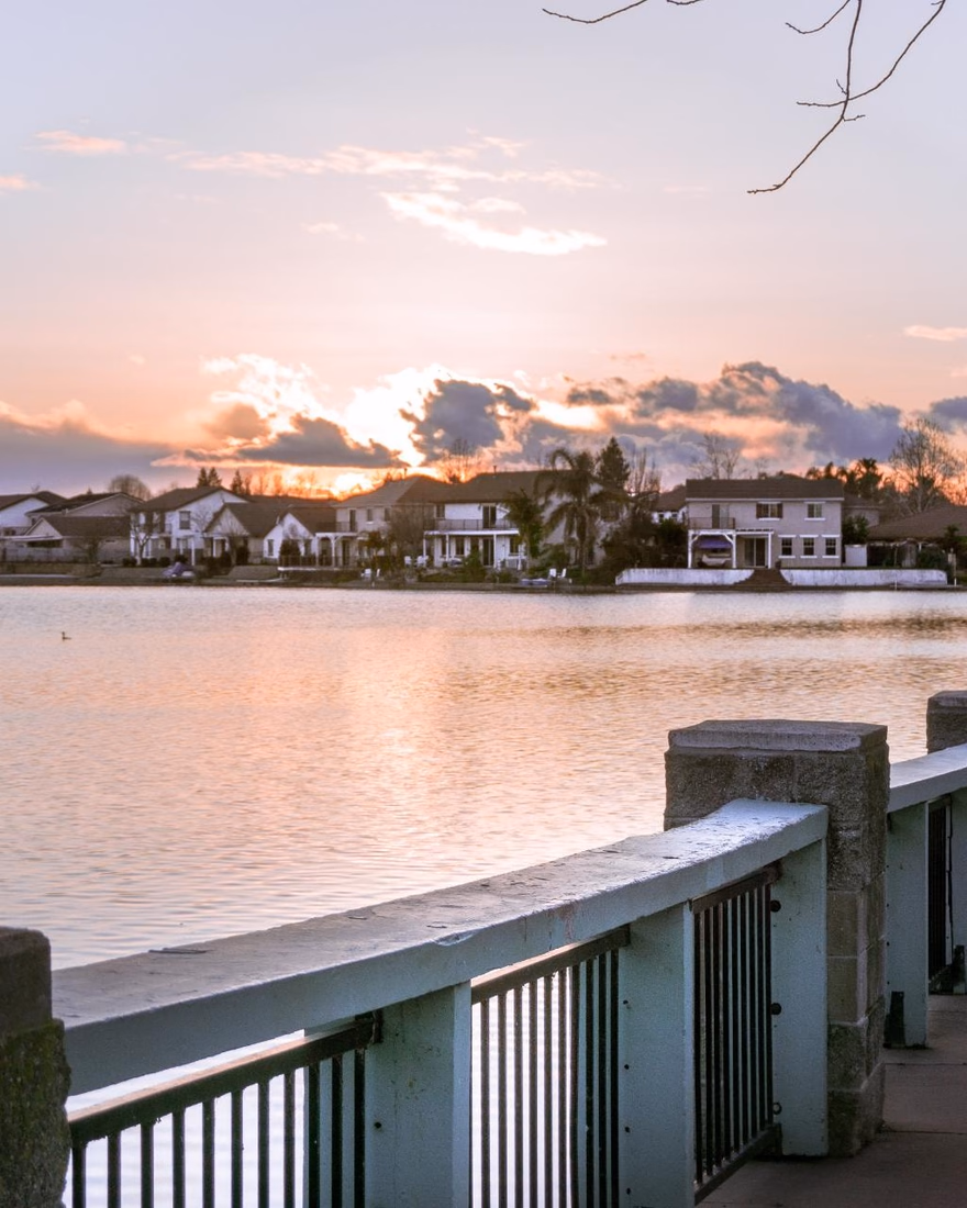 Lakeside walk with lamp posts at sunset in Elk Grove
