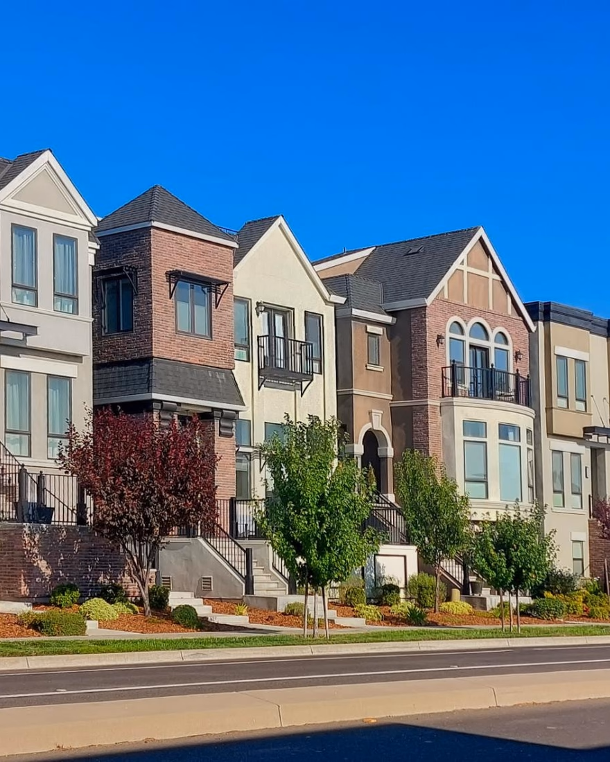 Row of townhomes with landscaped front yards
