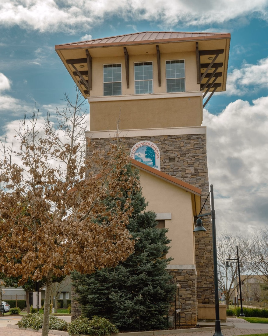 Clock tower framed by trees in Rancho Cordova