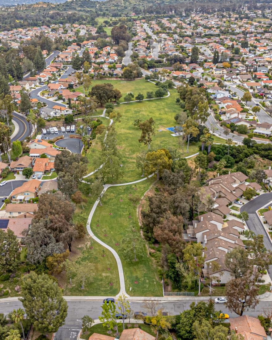 Aerial view of a neighborhood park surrounded by homes